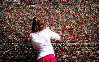 Gum Wall in Seattle | The Gum Wall is a trash heap in Seattle, in Post Alley under Pike Place Market. Similar to Bubblegum Alley in California, the Gum Wall is a brick wall now covered in used chewing gum. The wall is covered several inches thick, 15 feet high for 50 feet.